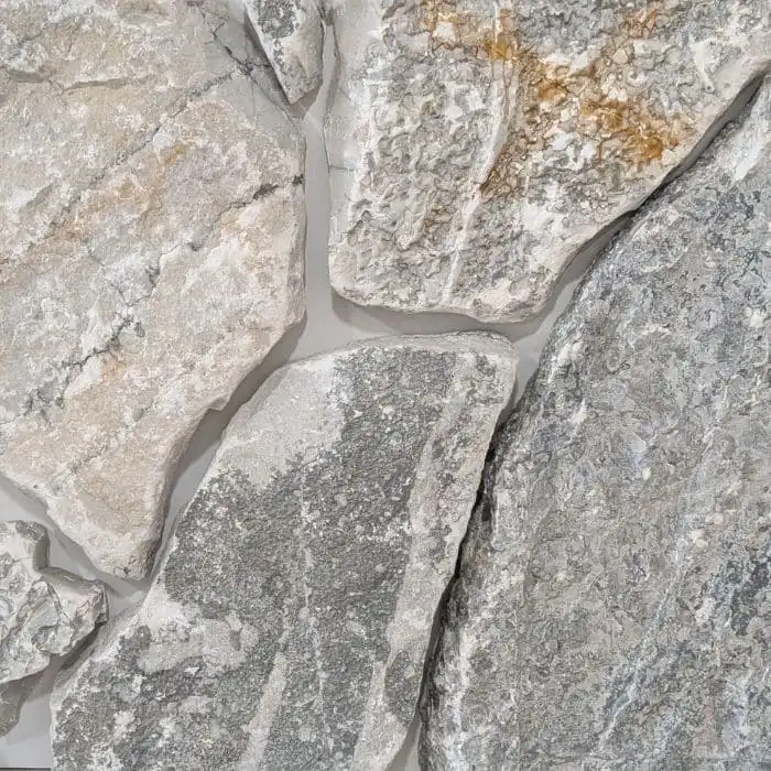 Mornington loose random wall cladding with blue-grey limestone tones, textured rocky edges, and organic natural stone finish for exterior feature walls.