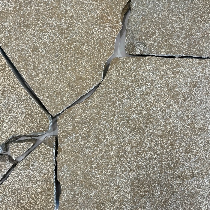 The Peela dark shotblasted and tumbled crazy paver is characterised by its desert taupe colour with pearlescent flecks throughout the stone. The Peela range evokes a sense of warmth and is perfect for projects that seek a "lived-in" finish.