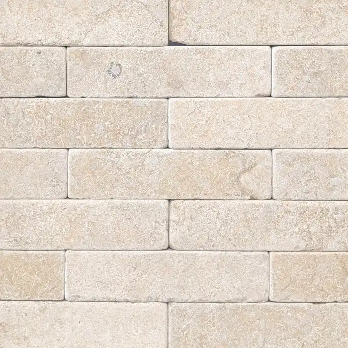 Brushed and tumbled limestone batons featuring warm cream tones in a linear natural stone format suitable for paving, flooring and feature applications.