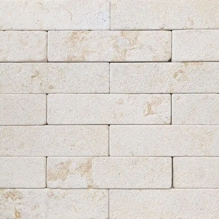 Crema Novelda brushed and tumbled limestone batons in soft cream tones with natural golden fossiling