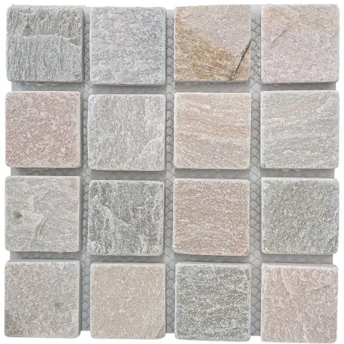 Sorrento Quartz tumbled cobblestone featuring soft grey, cream and blush tones used in an outdoor pathway design